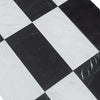 Black and white checkered marble tiles from Como in Carrara White and Nero Marquina set
