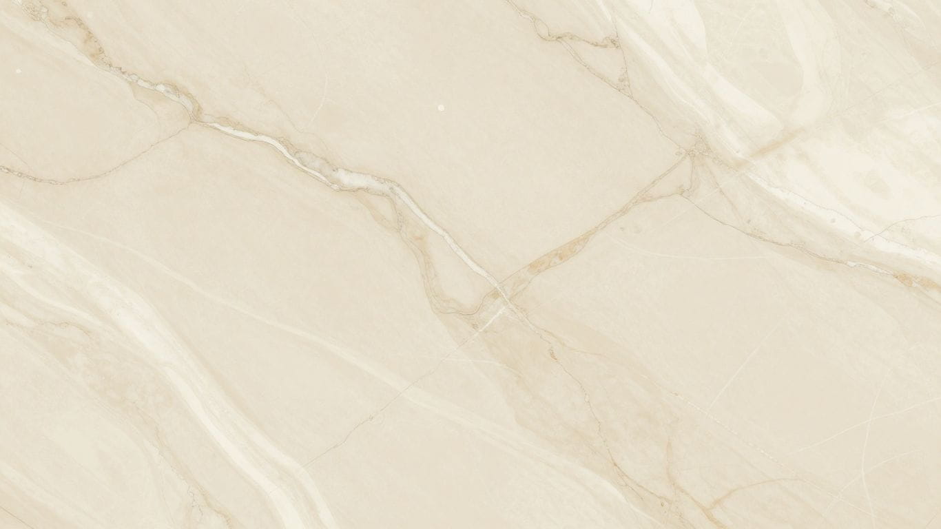 Crema Marfil marble tiles with natural veining.