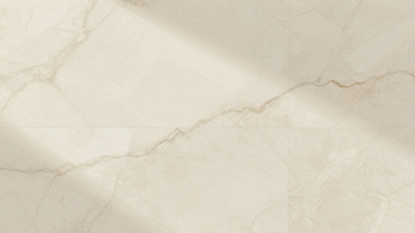 Crema Marfil marble tiles with creamy beige tones and subtle veining.