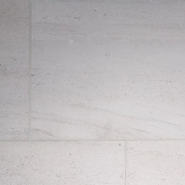 Crema Haven 12x24 limestone brushed tiles in light gray with subtle veining