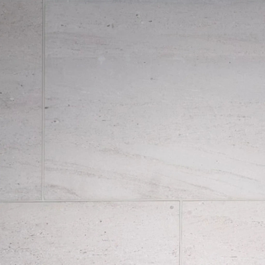 Crema Haven 18x18 limestone tiles in light gray marble with subtle veining