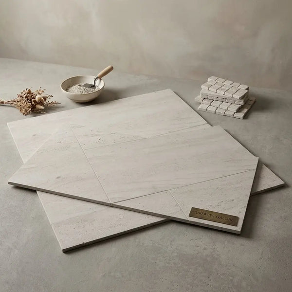 Crema haven 18x36 limestone floor tiles in light gray marble effect with subtle veining and matte finish in overlapping stacks
