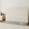 Crema haven 24x24 limestone beige marble-effect ceramic tile panel with subtle veining and matte finish on concrete base