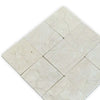 Light-colored square marble tiles with natural veining in Crema Marfil 4X4 Tumbled product