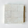 Crema Marfil 4X4 Tumbled light-colored marble tiles with natural veining