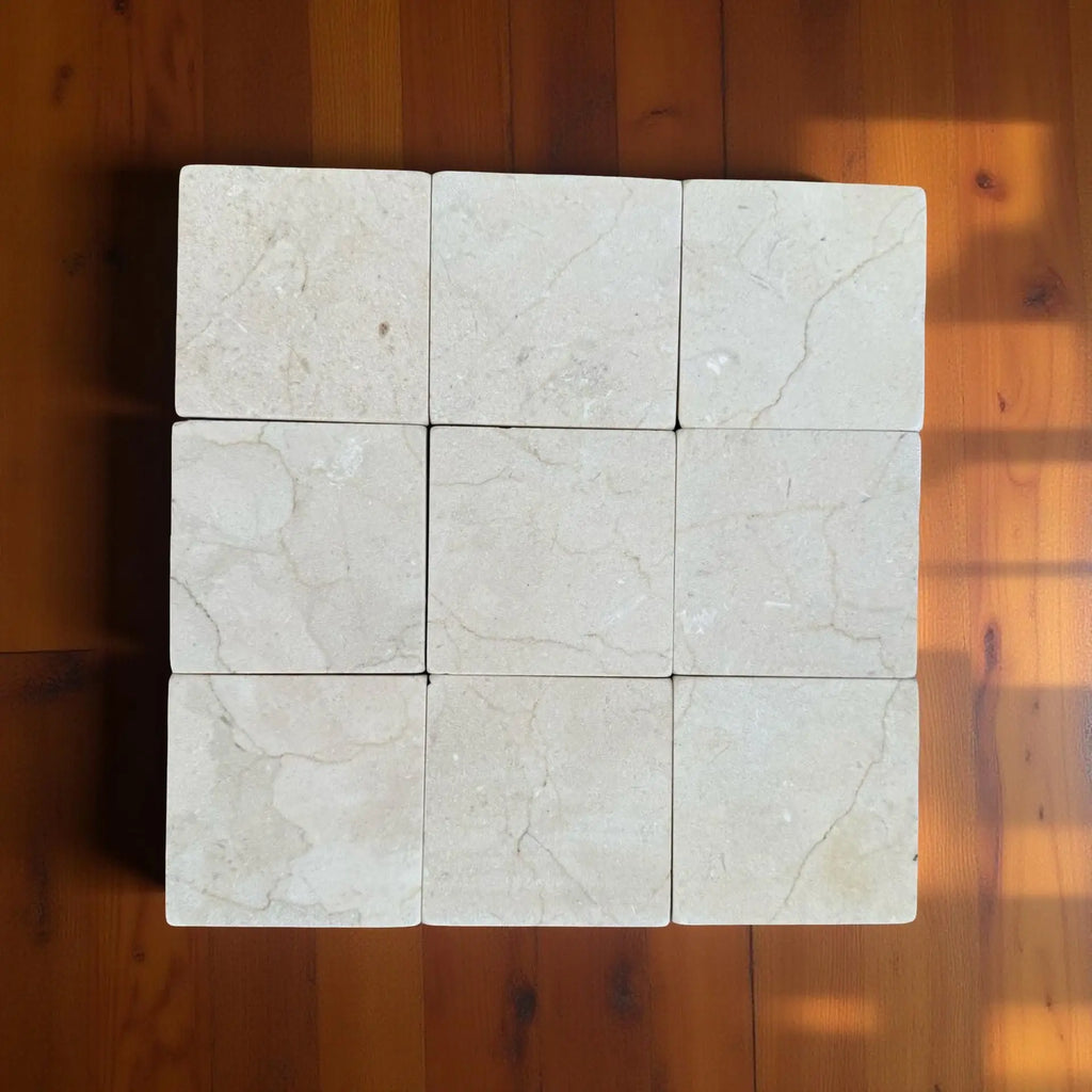 Crema Marfil 4x4 Tumbled off-white marble tiles with natural veining