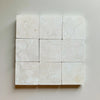 Crema Marfil 4X4 Tumbled off-white marble tiles with subtle veining pattern