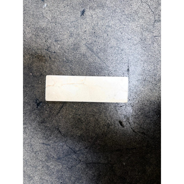 Crema Marfil 2x6 soft tumbled rectangular off-white ceramic sharpening stone with smooth surface and natural veining