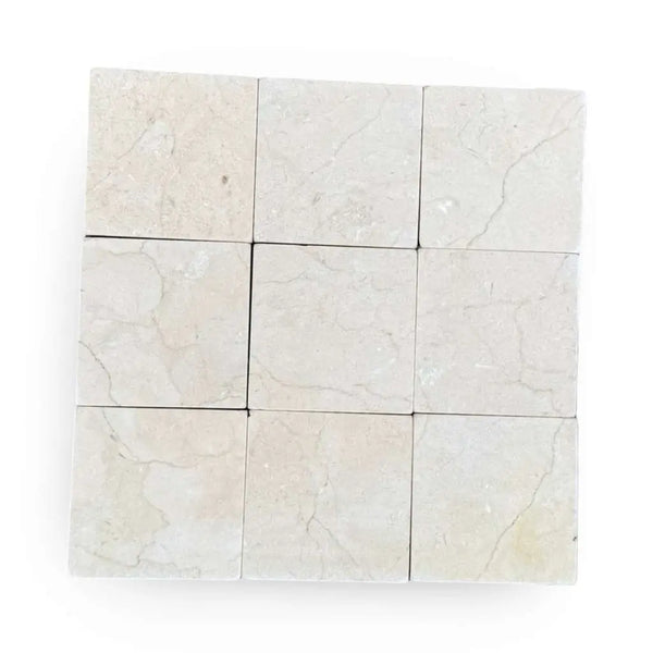 Crema Marfil 4x4 Tumbled marble tiles with light color and natural veining pattern