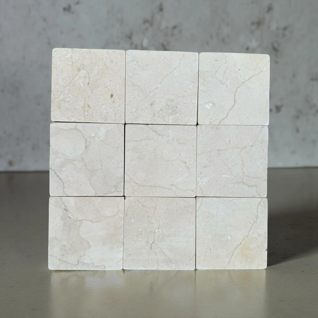 Crema Marfil 4X4 Tumbled marble tiles arranged in a 3x3 grid for elegant flooring