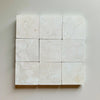 Crema Marfil 4X4 Tumbled off-white marble tiles with subtle veining pattern
