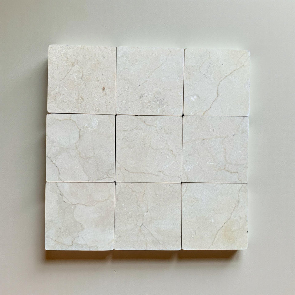 Crema Marfil 4X4 Tumbled off-white marble tiles with subtle veining pattern