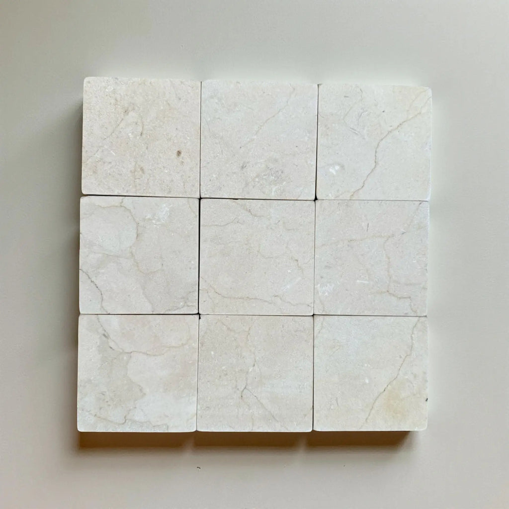 Crema Marfil 4X4 Tumbled off-white marble tiles with subtle veining pattern