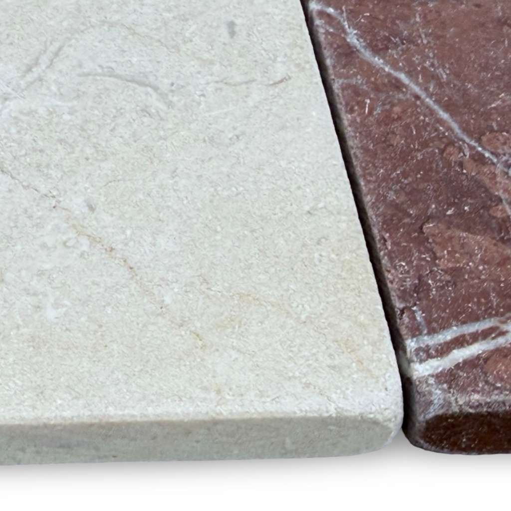 Natural stone samples showing light beige and reddish-brown veined tiles for Crema Marfil 4X4 Tumbled