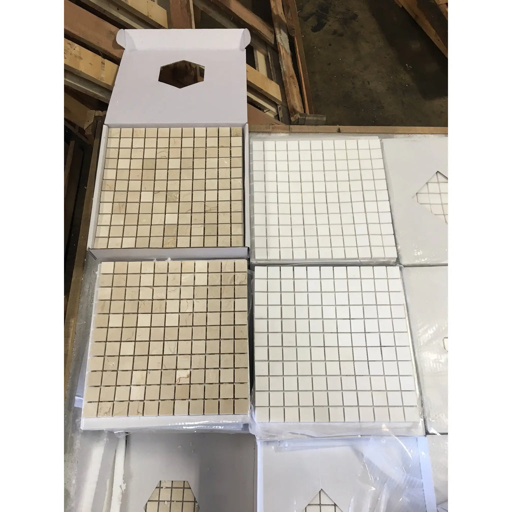 Crema Marfil marble 1x1 mosaic tiles in white and beige grid pattern, boxed with hexagonal cutouts