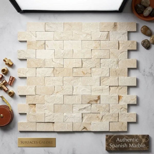 Beige rectangular Crema Marfil marble brick mosaic tiles with natural veining and rustic textured split-faced finish
