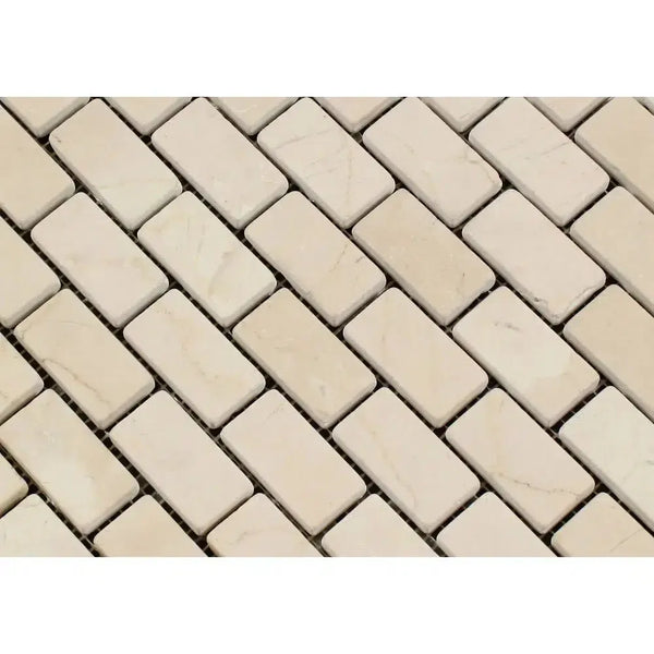 Beige rectangular mosaic tiles in Crema Marfil Marble 1X2 Brick Mosaic Tumbled design