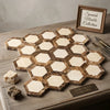 Crema marfil marble 2 inch vortex hexagon polished mosaic tiles with cream and brown veining in honeycomb pattern