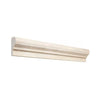 Cream-colored crema marfil marble 2x12 ornate crown molding liner with smooth textured surface and classic detailing