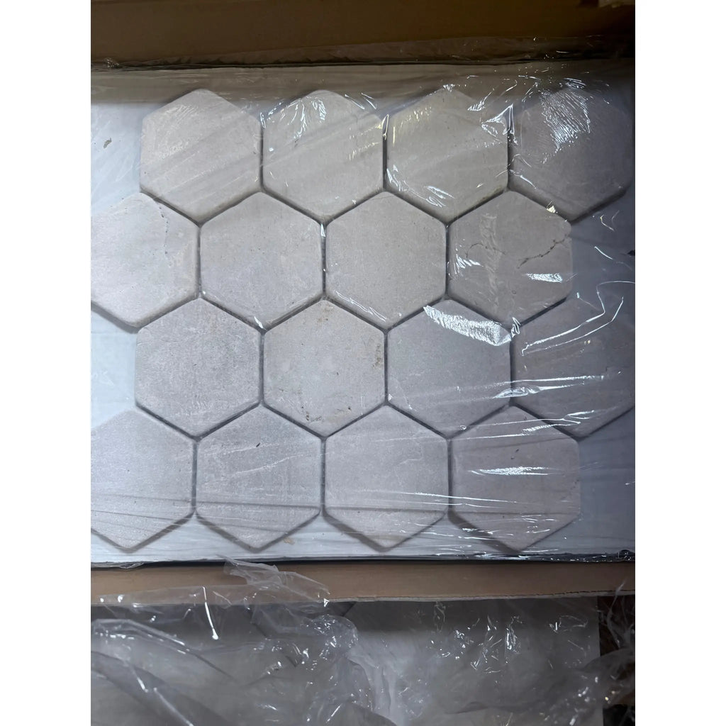 Crema Marfil Marble 3-inch tumbled hexagon mosaic in light gray matte finish