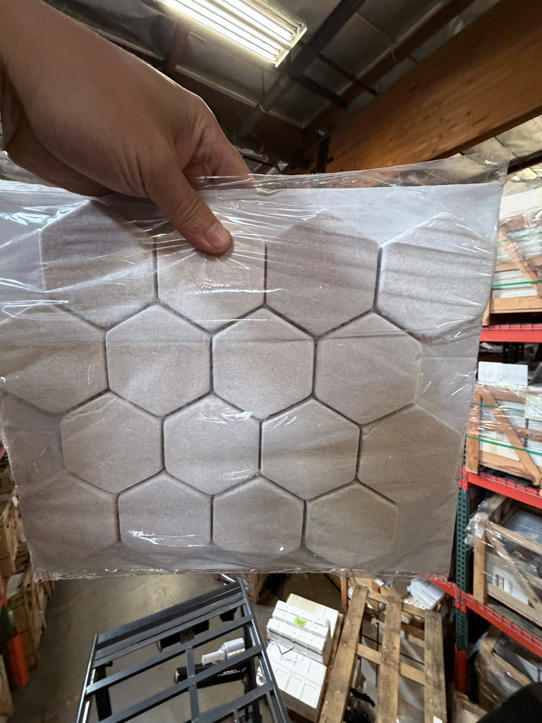 Crema Marfil Marble 3-inch Hexagon Mosaic Tumbled Tile Sheet in Clear Plastic