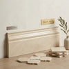 Beige crema marfil marble baseboard trim with smooth polished finish and subtle veining measuring 4 3/4 by 12 inches