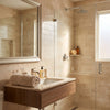 Beige towel on a modern wooden vanity with crema marfil marble 4x12 polished or honed countertop