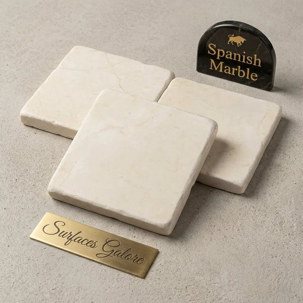 Cream-colored crema marfil marble 4x4 tumbled coasters with subtle veining pattern for elegant table use