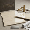 Cream-colored polished Crema Marfil marble tiles with subtle veining in 6x12 size for elegant flooring or walls