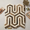Geometric mosaic tile panel of crema marfil marble with interlocking hexagonal pattern in brown and creamy white