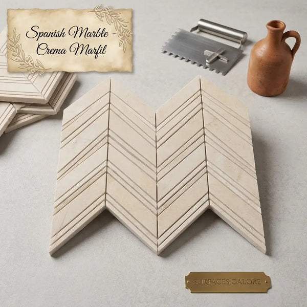 Beige spanish crema marfil marble chevron mosaic tiles with subtle veining and polished finish large size