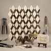 Crema marfil marble lattice diamond-patterned mosaic panel in cream and dark brown spanish marble on metallic stand