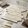 Beige crema marfil marble manhattan mosaic tile panel with subtle veining and staggered rectangular layout polished or honed