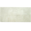 Crema Marfil Marble Octave Mosaic tiles with dark dots, showcasing light-colored stones