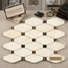 Beige and brown crema marfil marble mosaic tile with hexagonal pattern and dark dot accents polished or honed finish