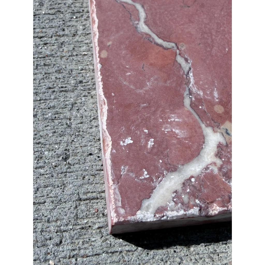 Crema Marrfil Rustic Modern Tumbled reddish-pink marble tile with white veining on gray concrete