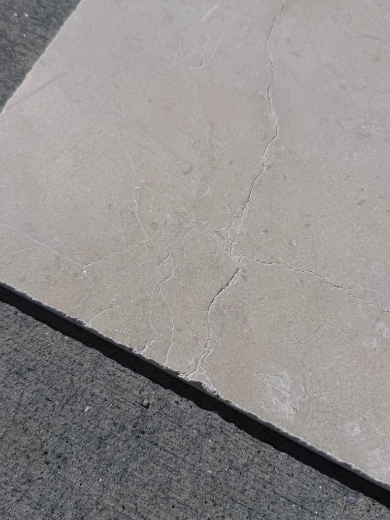 Crema Marrfil Rustic Modern Tumbled light gray stone tile with veining, cracks