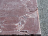 Crema Marrfil Rustic Modern Tumbled reddish-brown stone slab with cracks