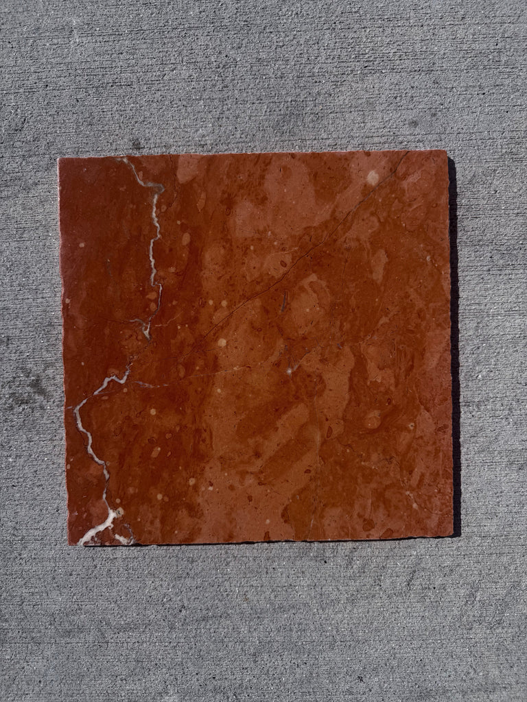 Crema Marrfil Rustic Modern Tumbled square reddish-brown marble tile with veining and left edge crack