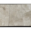 Three polished beige marble effect diano royal queen beige 12x24 tiles with subtle gray veining and glossy finish
