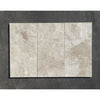 Three rectangular beige polished or honed Diano Royal Queen Beige marble tiles with subtle gray and tan veining