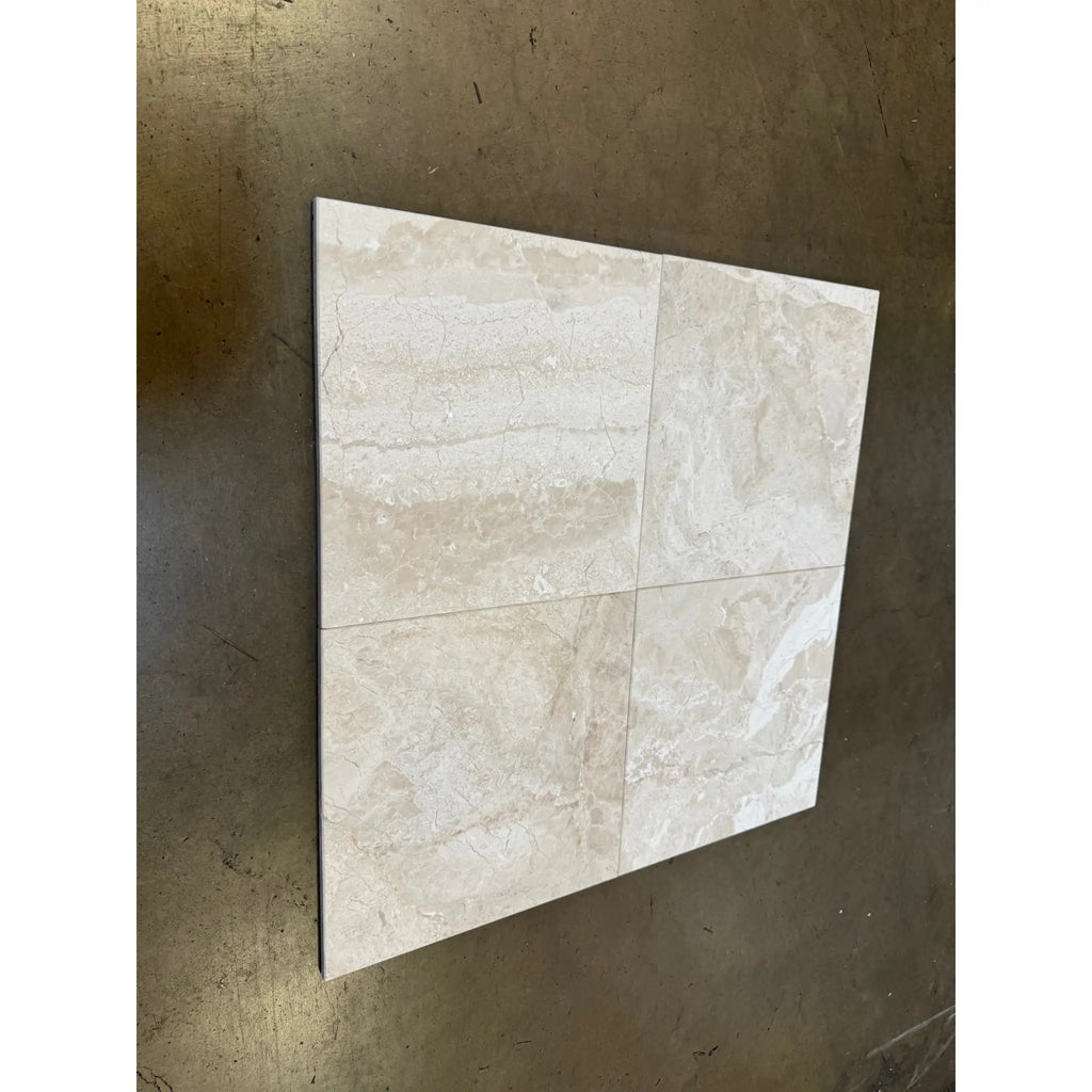 Four square beige marble effect Diano Royal queen beige 18x18 polished or honed tiles arranged in a grid