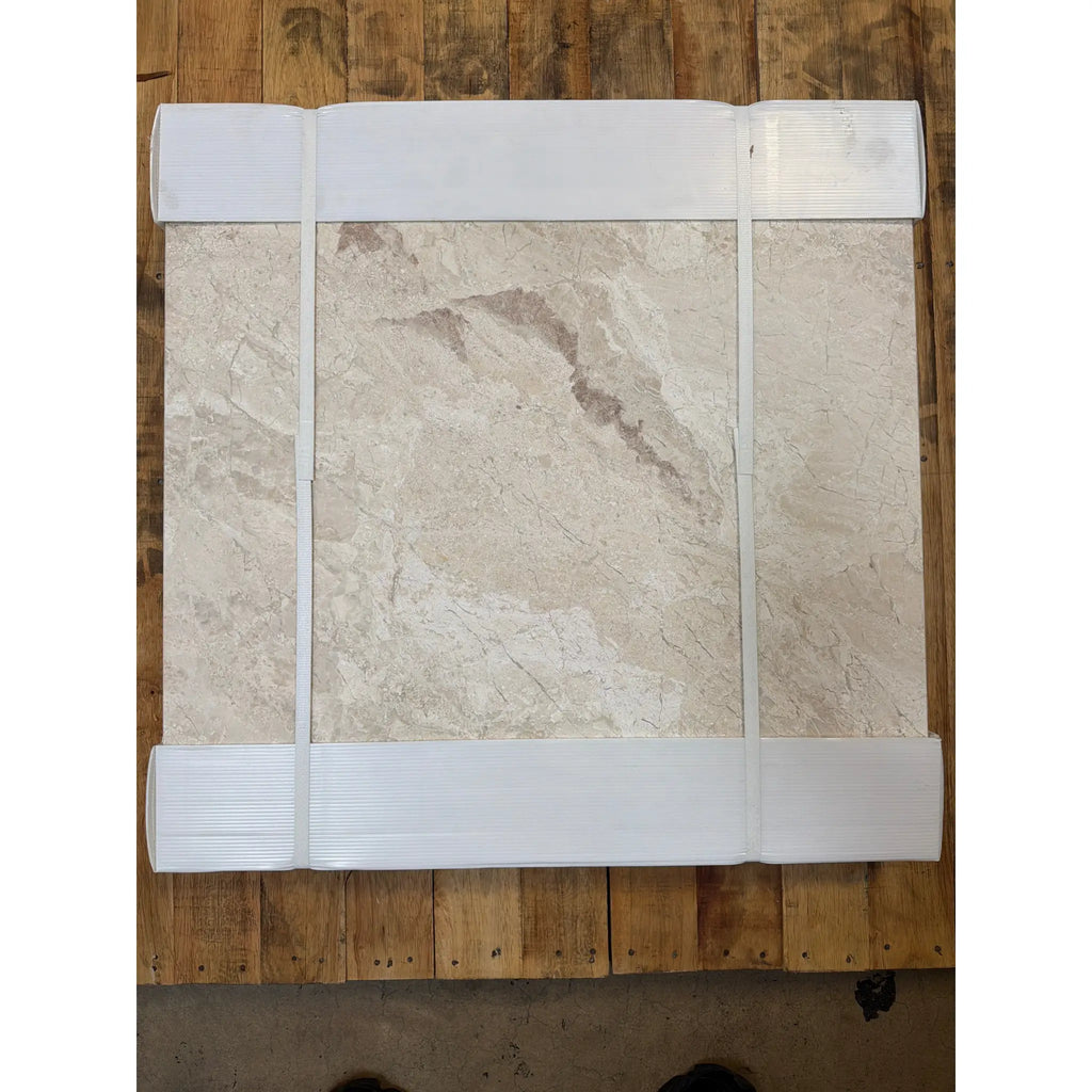 Diano Royal Queen Beige marble-effect tile with white trim, 24x24 polished