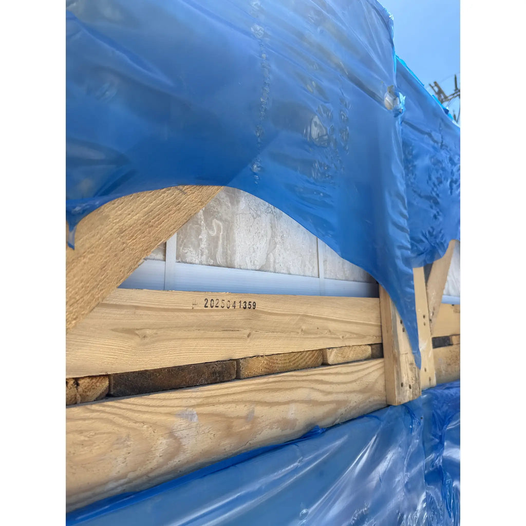 Wooden crate covered in blue plastic for Diano Royal Queen Beige Marble tiles