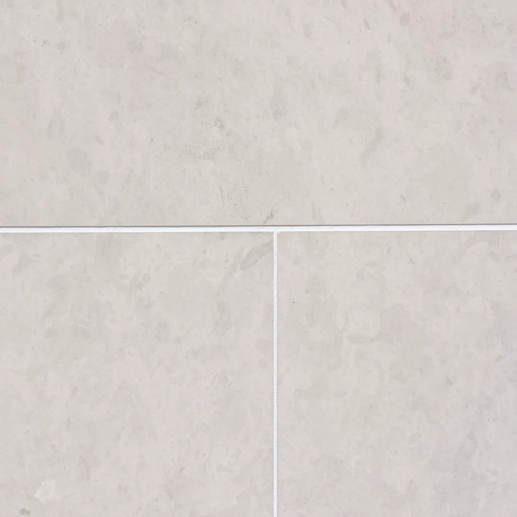 Dolce Crema 12x12 light gray marble-effect limestone tiles with white grout