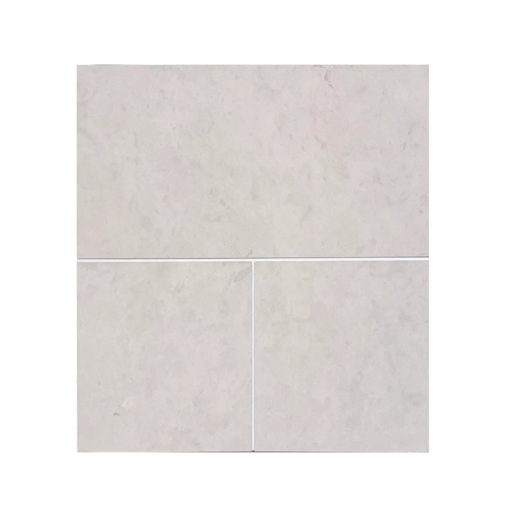 Light gray Dolce Crema 12x12 limestone marble-effect square tiles with subtle veining
