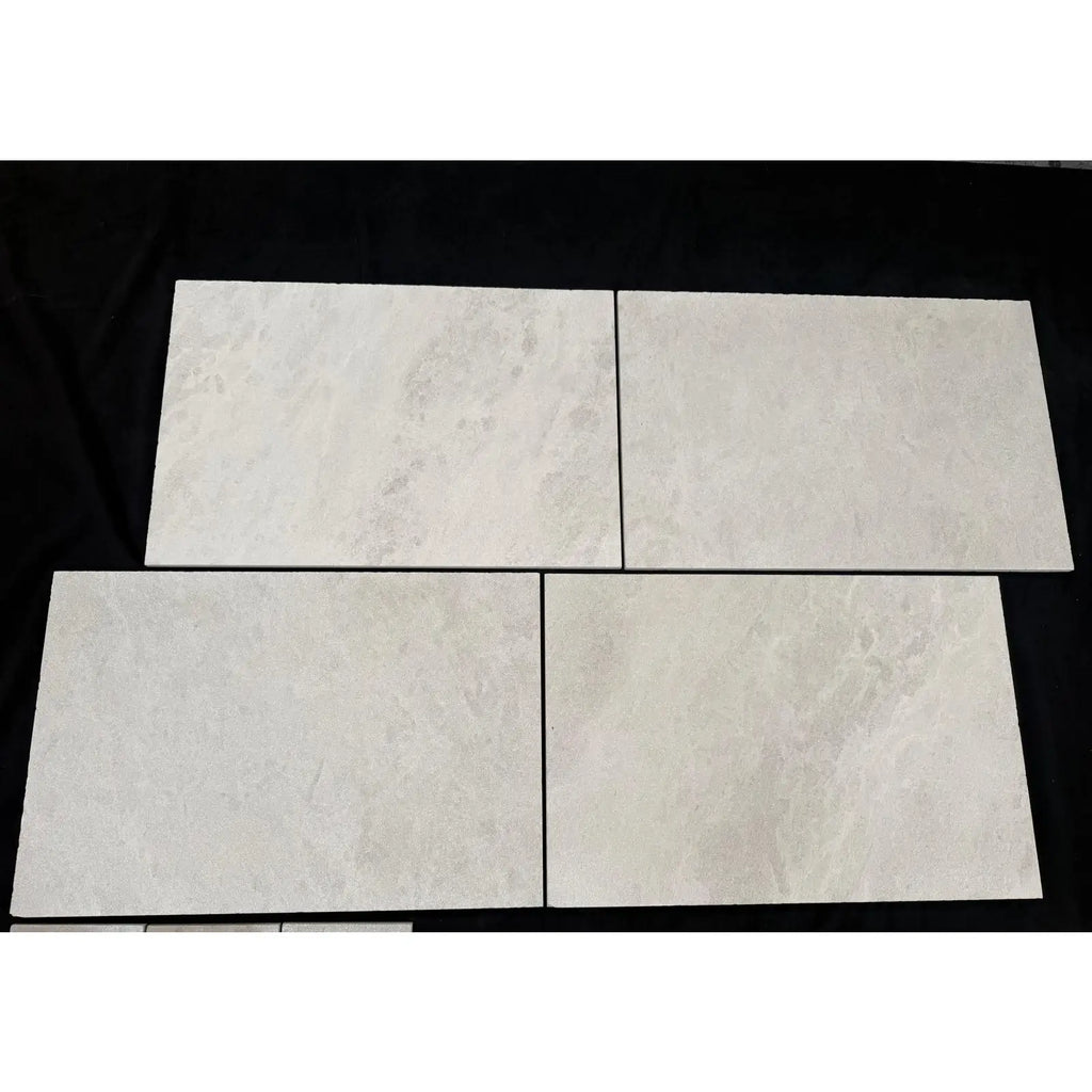 Dolce Crema 12X24 limestone: four light gray marbled matte tiles