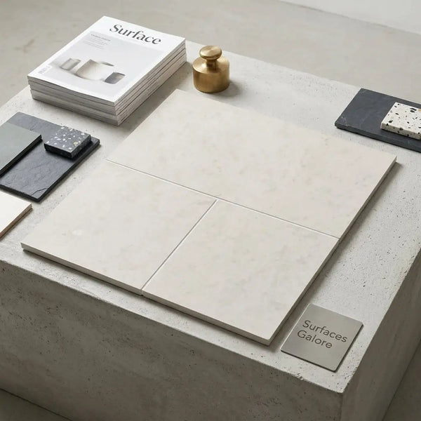 Cream-colored dolce crema 18x18 limestone marble tiles with subtle veining in a minimalist arrangement