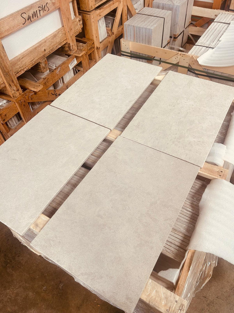 Dolce Crema 18X18 Limestone beige tiles on wooden pallets in warehouse
