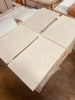 Dolce Crema 18X18 Limestone tiles stacked on wooden pallet